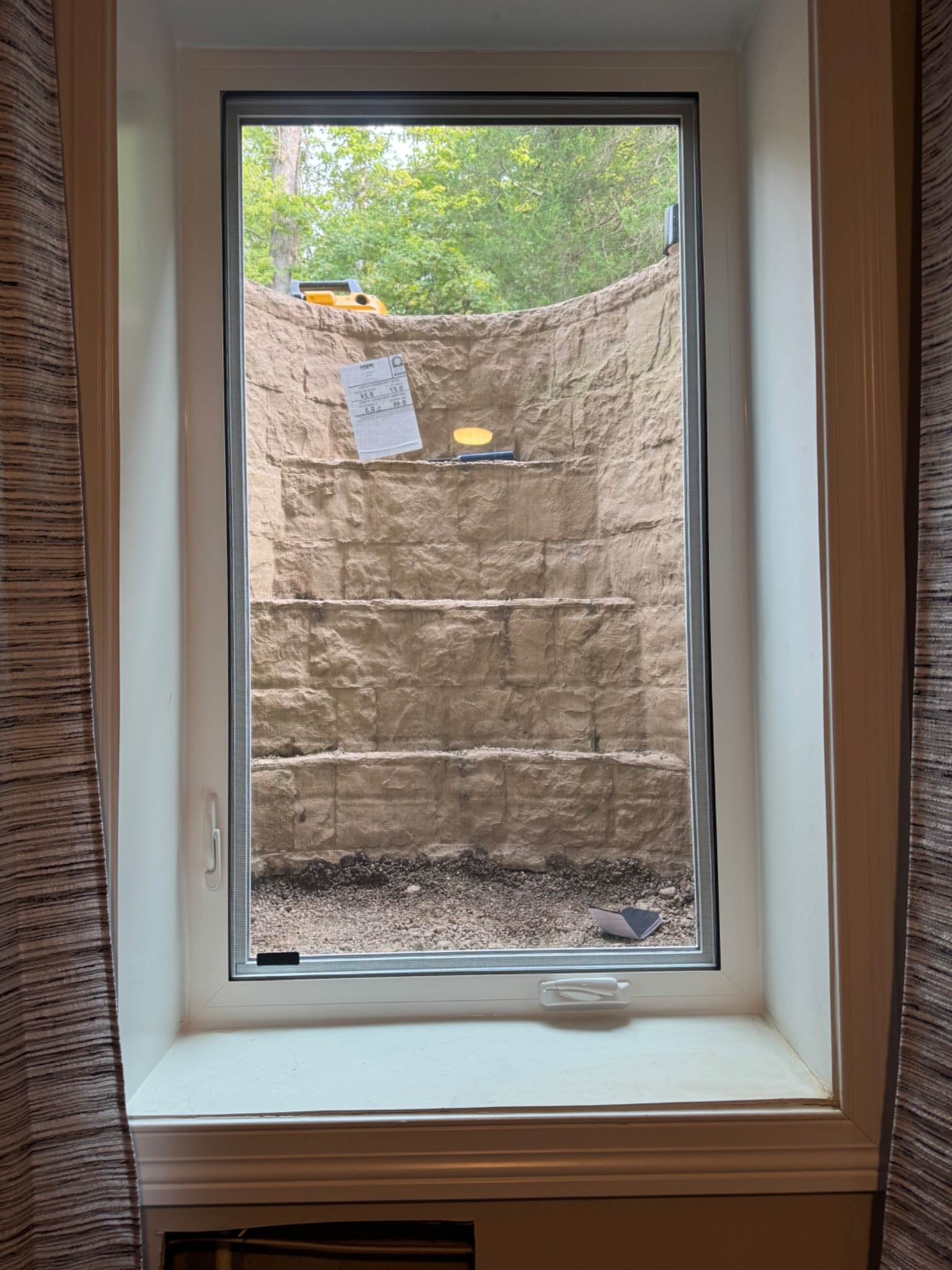 Interior view of new white casement egress window installed in Centerville Ohio basement